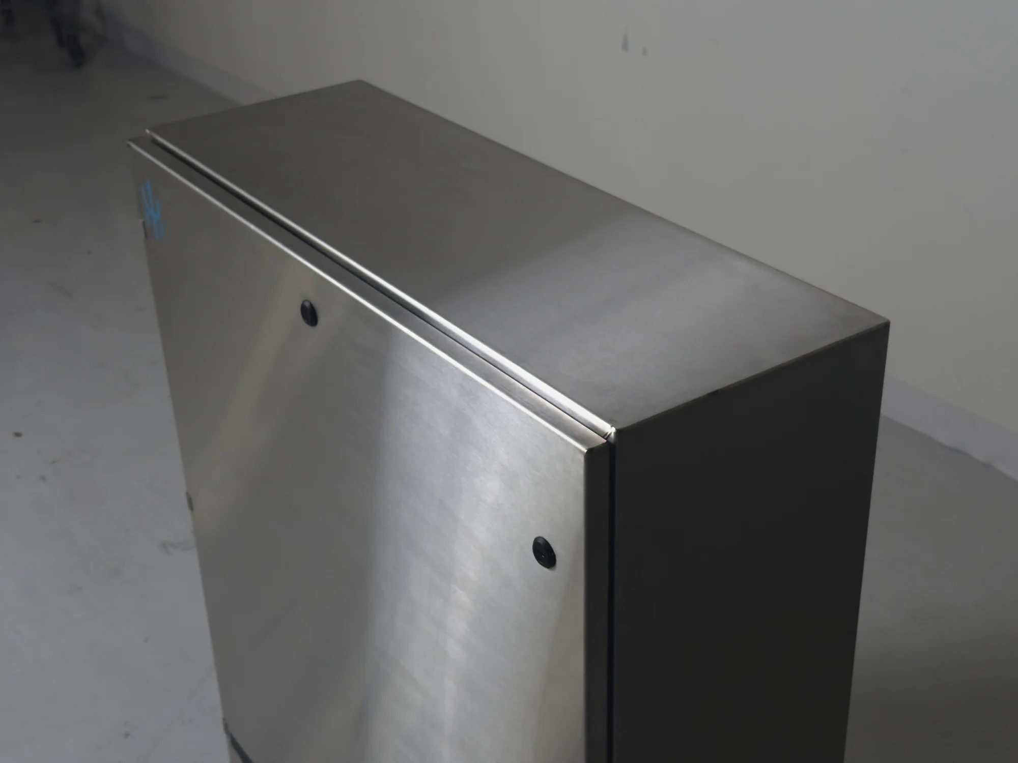 Door-seam detail of the stainless Mariana Minerals remote I/O enclosure.